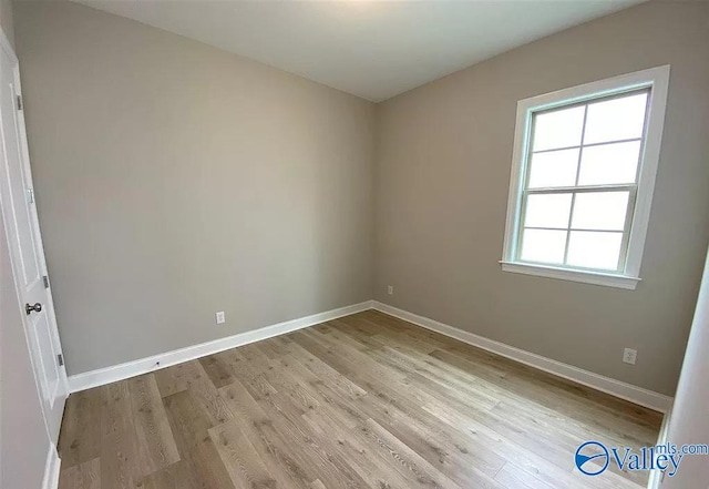 empty room with light hardwood / wood-style floors