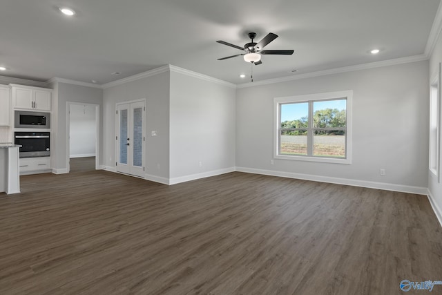 unfurnished living room with ceiling fan, dark hardwood / wood-style flooring, and ornamental molding