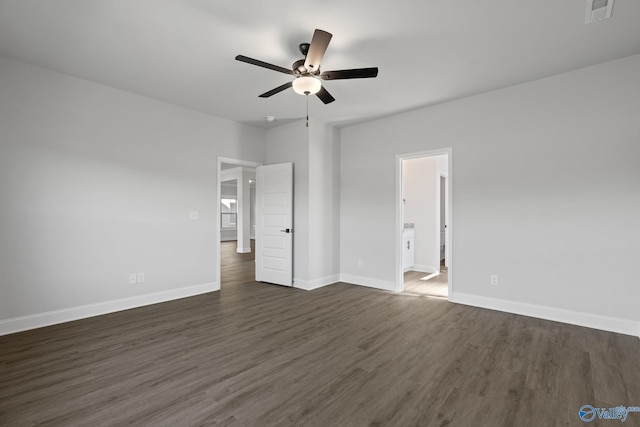 unfurnished bedroom with ceiling fan, ensuite bathroom, and dark hardwood / wood-style floors