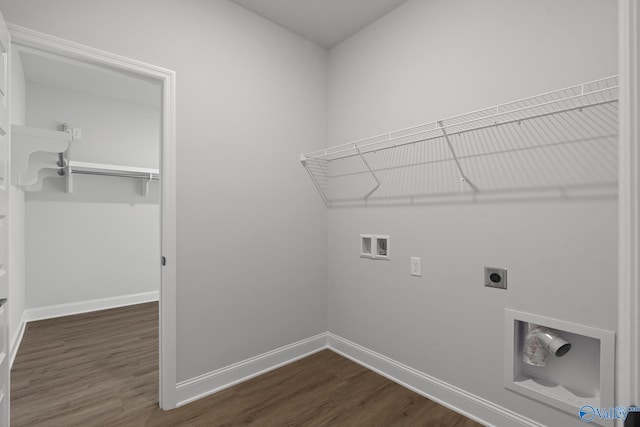 clothes washing area with hookup for a washing machine, dark hardwood / wood-style floors, and electric dryer hookup