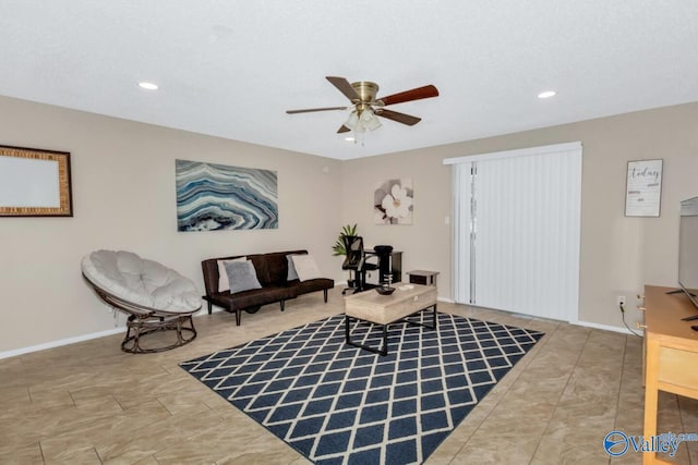 living area featuring ceiling fan