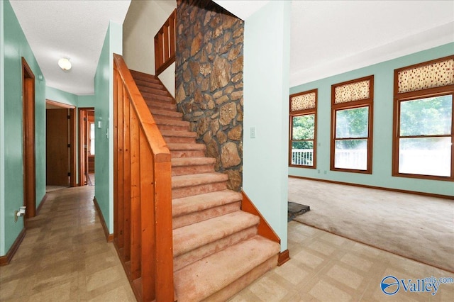 143 Maze Dr, Hartselle, AL 35640 - stairway featuring baseboards, carpet flooring, and tile patterned floors