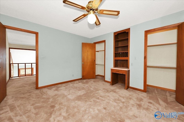 143 Maze Dr, Hartselle, AL 35640 - unfurnished bedroom featuring carpet floors, baseboards, and ceiling fan