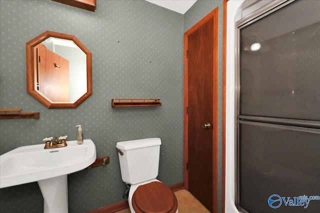 143 Maze Dr, Hartselle, AL 35640 - bathroom with toilet and wallpapered walls
