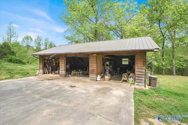 143 Maze Dr, Hartselle, AL 35640 - detached garage featuring central AC