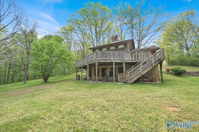 143 Maze Dr, Hartselle, AL 35640 - back of house featuring a chimney, a wooden deck, a lawn, and stairway
