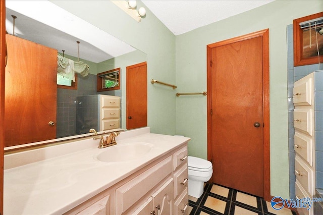 143 Maze Dr, Hartselle, AL 35640 - bathroom featuring vanity, toilet, tile patterned floors, and a shower