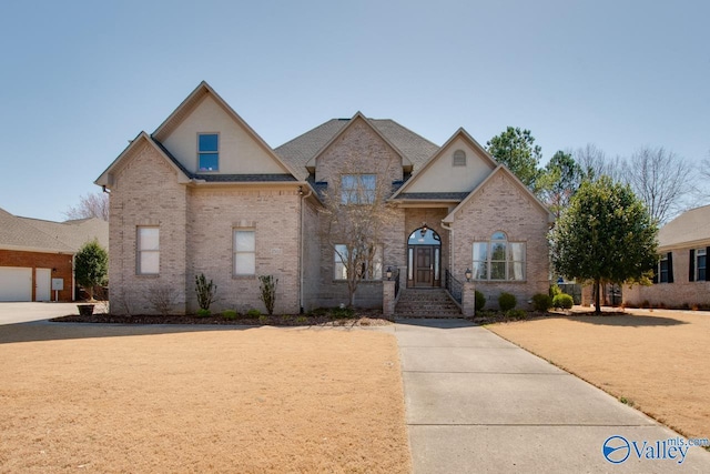 view of front of property featuring brick siding