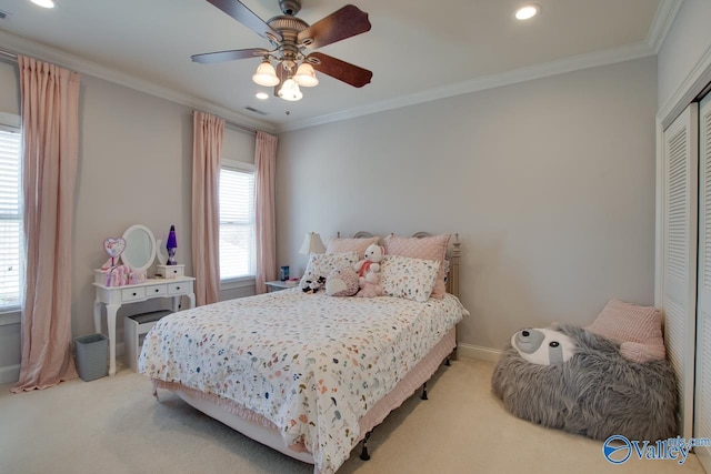 carpeted bedroom featuring baseboards, visible vents, a closet, and ornamental molding