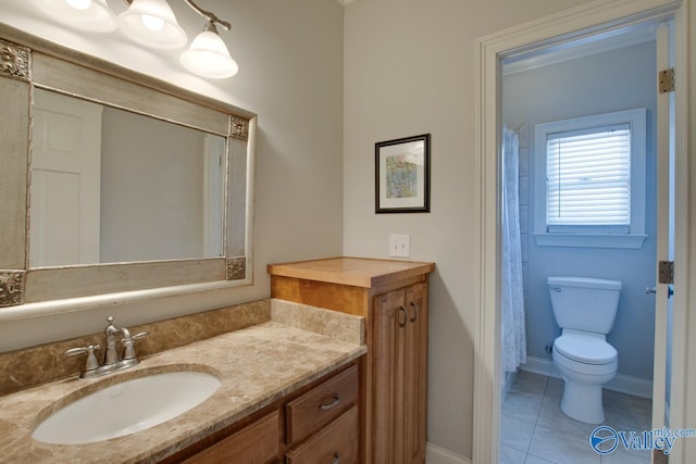 full bathroom with tile patterned floors, toilet, vanity, and baseboards