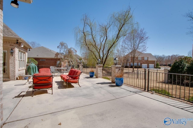 view of patio / terrace featuring fence