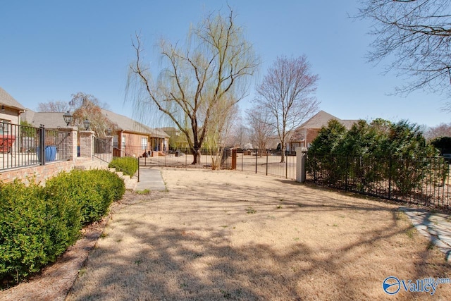 view of yard with a gate and fence