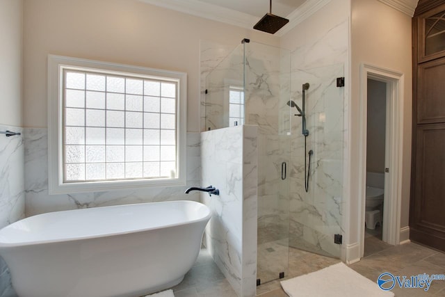 bathroom featuring a marble finish shower, a freestanding bath, ornamental molding, tile walls, and toilet