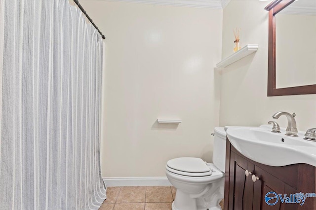 bathroom featuring ornamental molding, vanity, toilet, and tile patterned floors