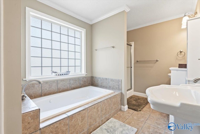 bathroom with plus walk in shower, ornamental molding, tile patterned floors, and a healthy amount of sunlight