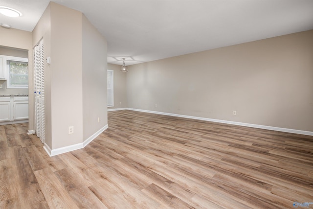 empty room with light hardwood / wood-style floors