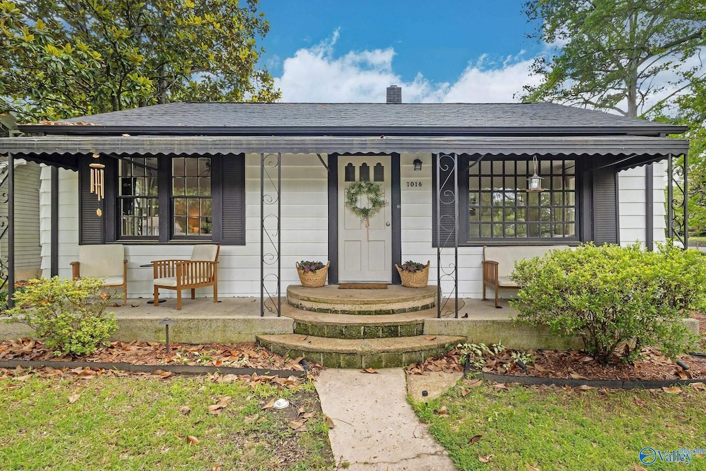 1016 3rd St SW, Cullman, AL 35055 - view of front of house with covered porch and a shingled roof