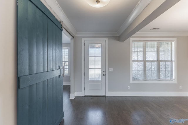 doorway to outside with a barn door, ornamental molding, and dark wood-type flooring