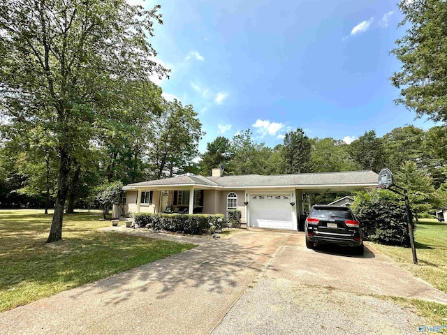 ranch-style house featuring a garage and a front lawn