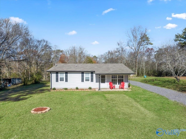 ranch-style house featuring a porch and a front lawn