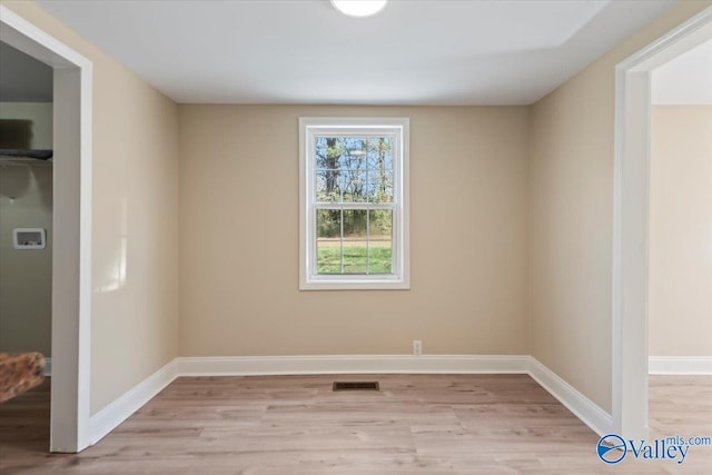 spare room with light hardwood / wood-style floors