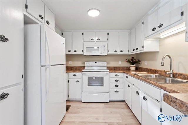 kitchen with light hardwood / wood-style floors, white cabinetry, white appliances, and sink