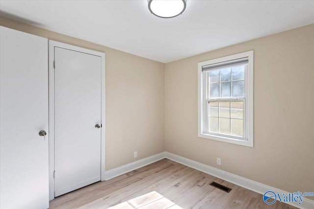 unfurnished room featuring light wood-type flooring