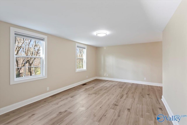 unfurnished room featuring light wood-type flooring