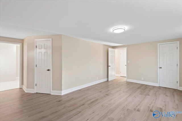 spare room with light wood-type flooring