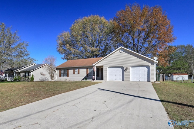 ranch-style house featuring a front lawn and a garage