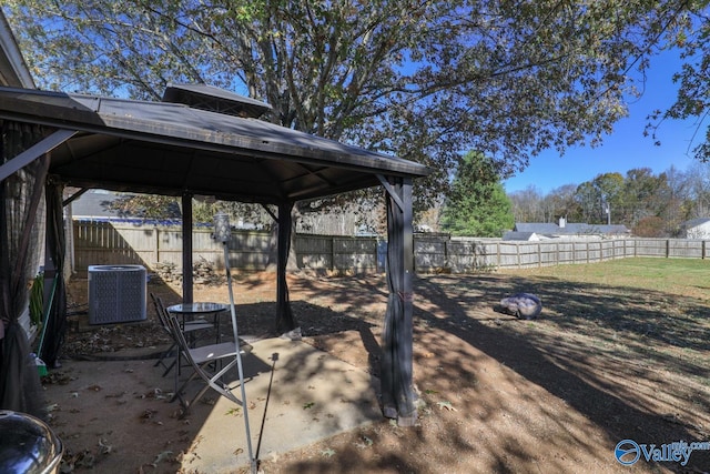 view of yard featuring a gazebo and central air condition unit