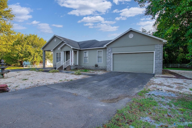 2220 Jefferson St, Courtland, AL 35618 - ranch-style home with fence, driveway, and a garage