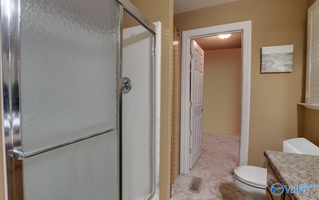 2220 Jefferson St, Courtland, AL 35618 - full bathroom with a shower stall, toilet, tile patterned flooring, and vanity