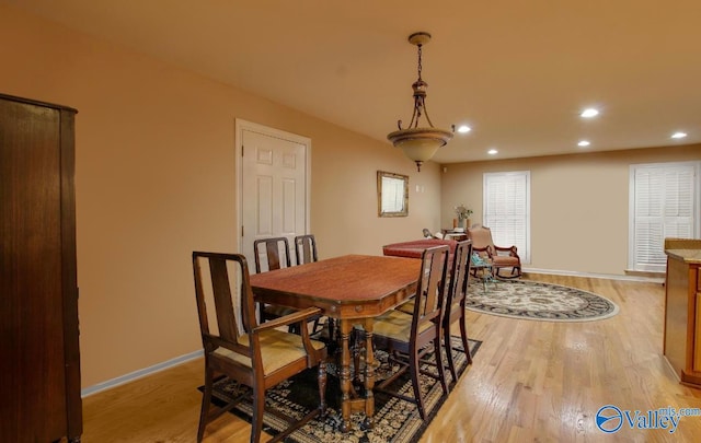 dining space featuring light wood-type flooring