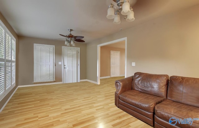 2220 Jefferson St, Courtland, AL 35618 - living area featuring ceiling fan, baseboards, wood finished floors, and healthy amount of natural light