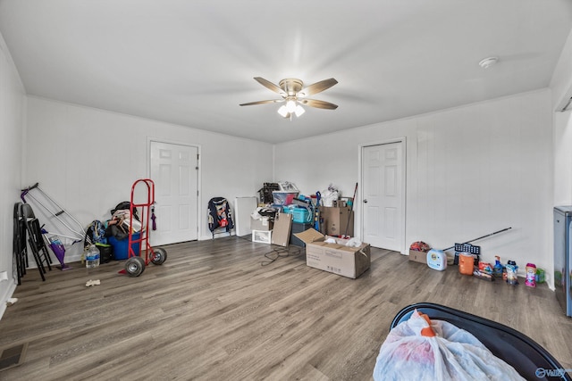 playroom featuring visible vents, wood finished floors, and ceiling fan