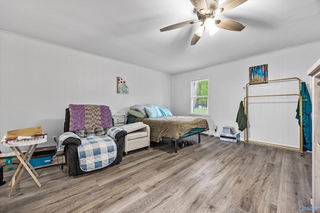 bedroom with wood finished floors and ceiling fan
