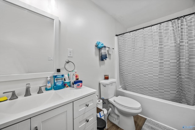 full bathroom featuring shower / bathtub combination with curtain, wood finished floors, toilet, and vanity