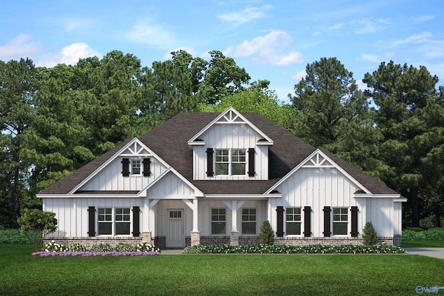 view of front of home with a front yard, brick siding, board and batten siding, and roof with shingles