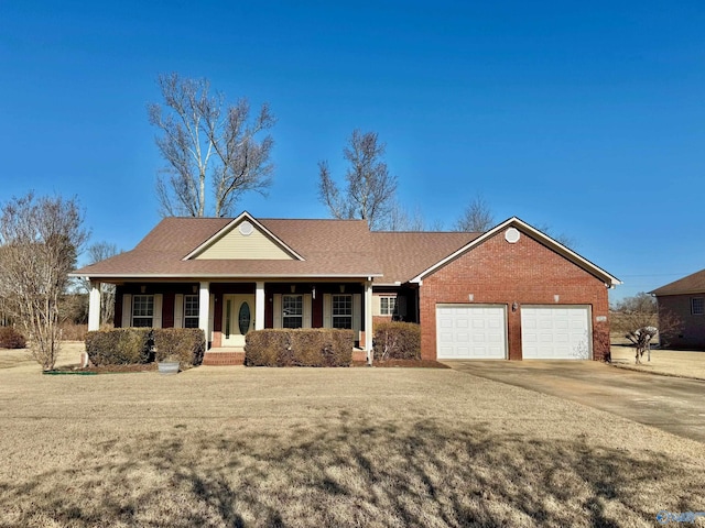 17215 Eunice Ln, Athens, AL 35613 - ranch-style house with covered porch, an attached garage, brick siding, driveway, and a front lawn