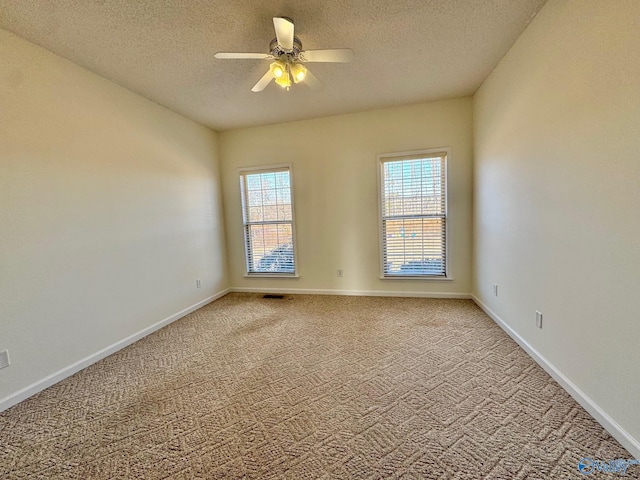 17215 Eunice Ln, Athens, AL 35613 - carpeted empty room with a textured ceiling, a ceiling fan, and baseboards