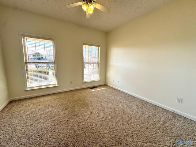 17215 Eunice Ln, Athens, AL 35613 - carpeted empty room featuring a textured ceiling, a ceiling fan, and baseboards