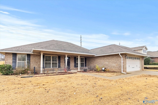 213 De Jan Rd, Madison, AL 35758 - ranch-style home featuring a porch, a garage, and a front lawn