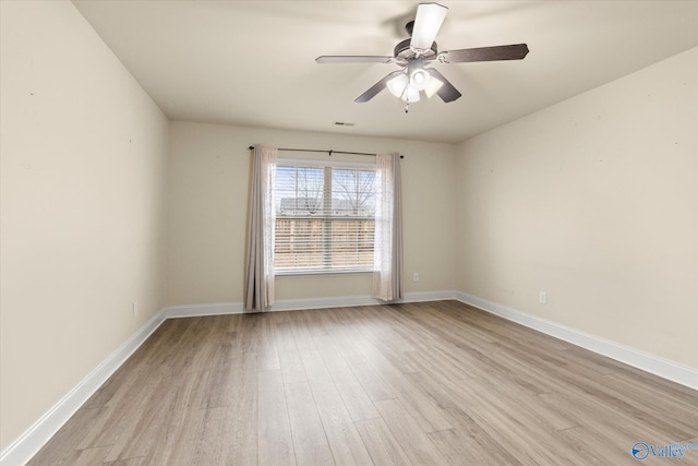 spare room featuring ceiling fan and light wood-type flooring