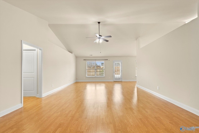 unfurnished living room featuring ceiling fan, vaulted ceiling, and light hardwood / wood-style flooring