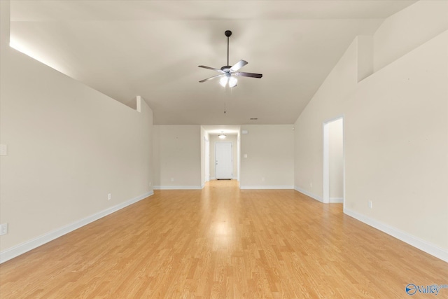 unfurnished room with ceiling fan, lofted ceiling, and light hardwood / wood-style floors