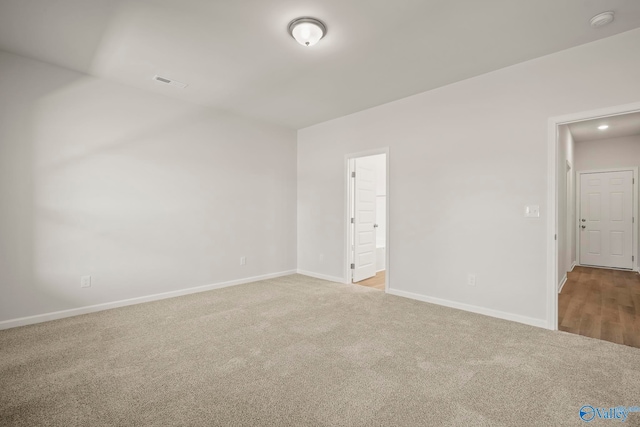 unfurnished bedroom featuring light colored carpet