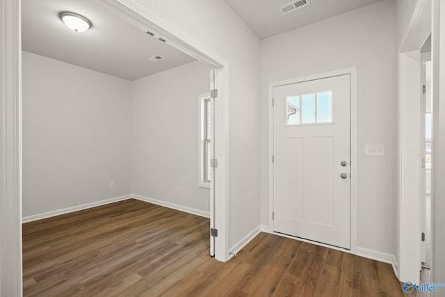 entryway with hardwood / wood-style floors