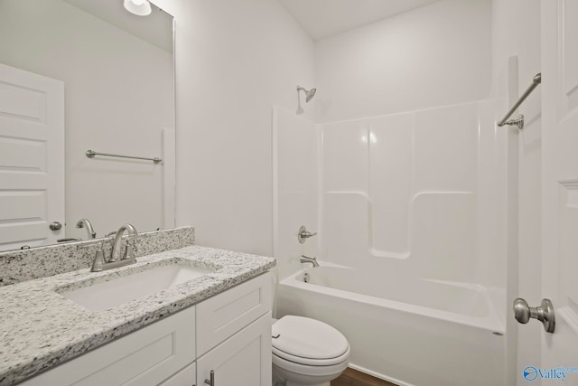 full bathroom featuring vanity, toilet, and washtub / shower combination