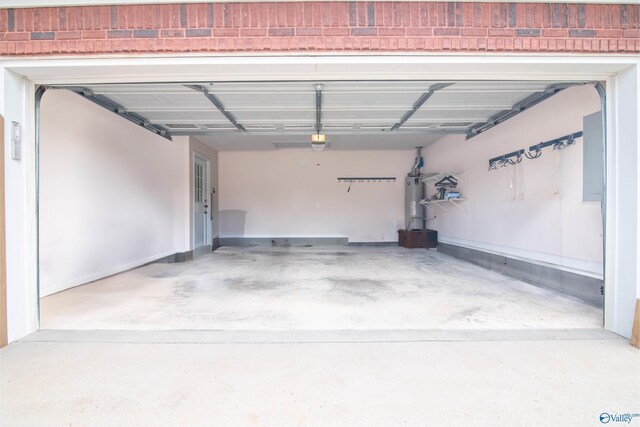 garage with water heater and a garage door opener